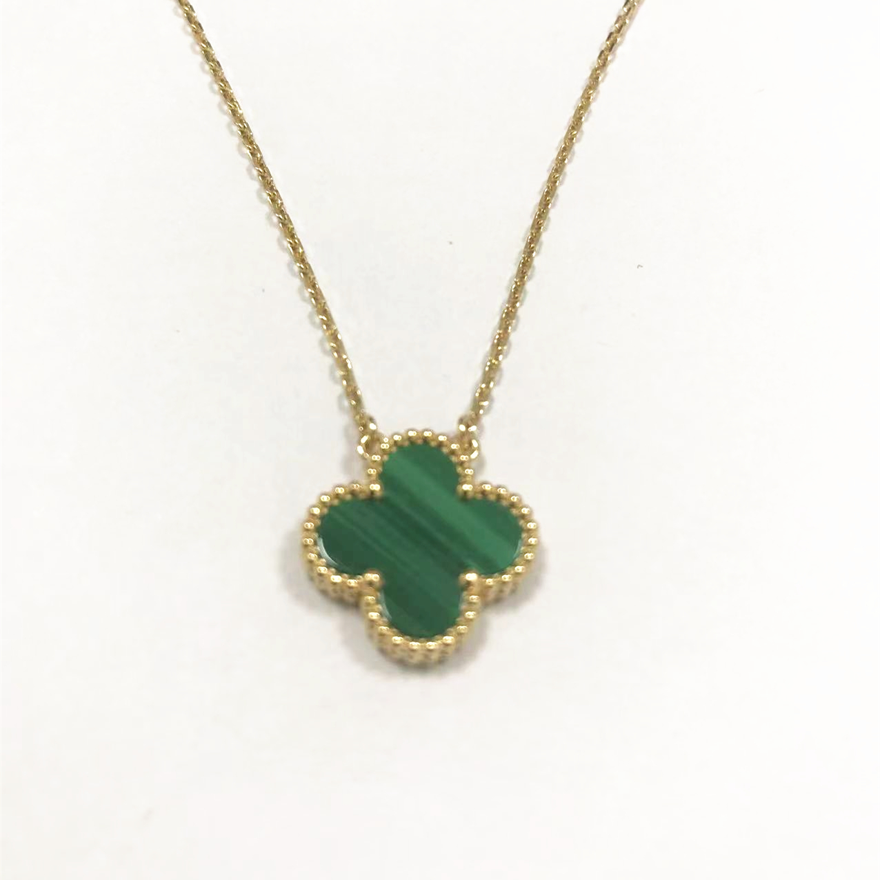 Vintage Van Cleef Fake Alhambra Gold Necklace Malachite Pendant Vintage Alhambra pendant, 18K yellow gold, malachite. REFERENCE: VCARO9VA00 STONE: Malachite: 1 stone CLASP: Hallmark clasp, small model in 18K yellow gold SIZE: Chain length: 16.54 inches